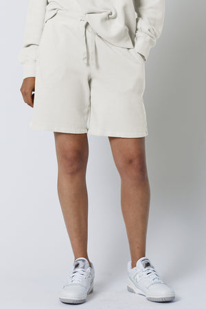 The model is wearing a white LAGUNA SWEATSHORT by Velvet by Jenny Graham.