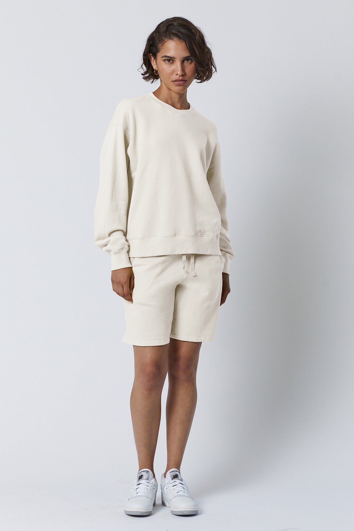   The model is wearing a Velvet by Jenny Graham LAGUNA SWEATSHORT and shorts. 