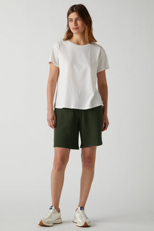 a woman wearing a white t - shirt and green Velvet by Jenny Graham LAGUNA SWEATSHORT.