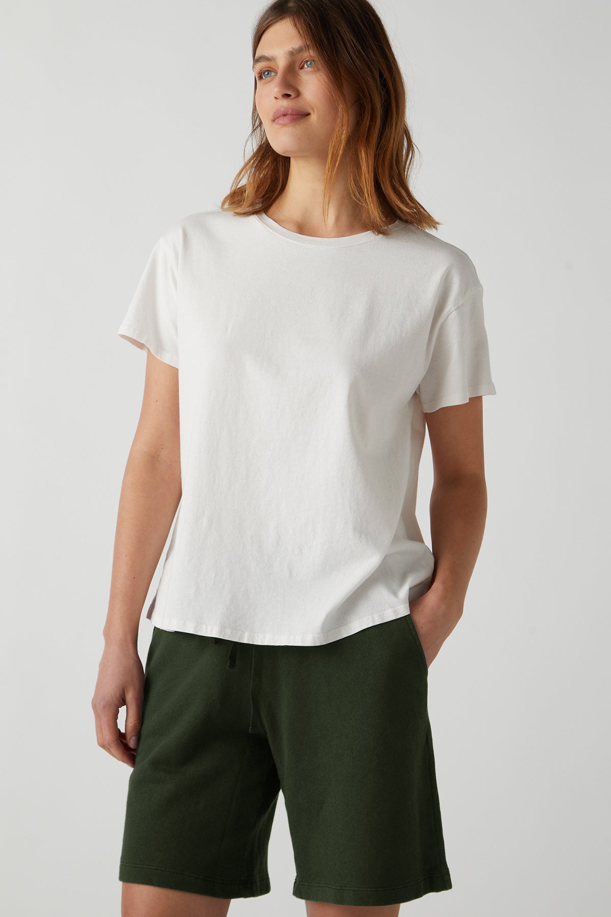   a woman wearing a white t-shirt and Velvet by Jenny Graham's LAGUNA SWEATSHORT. 