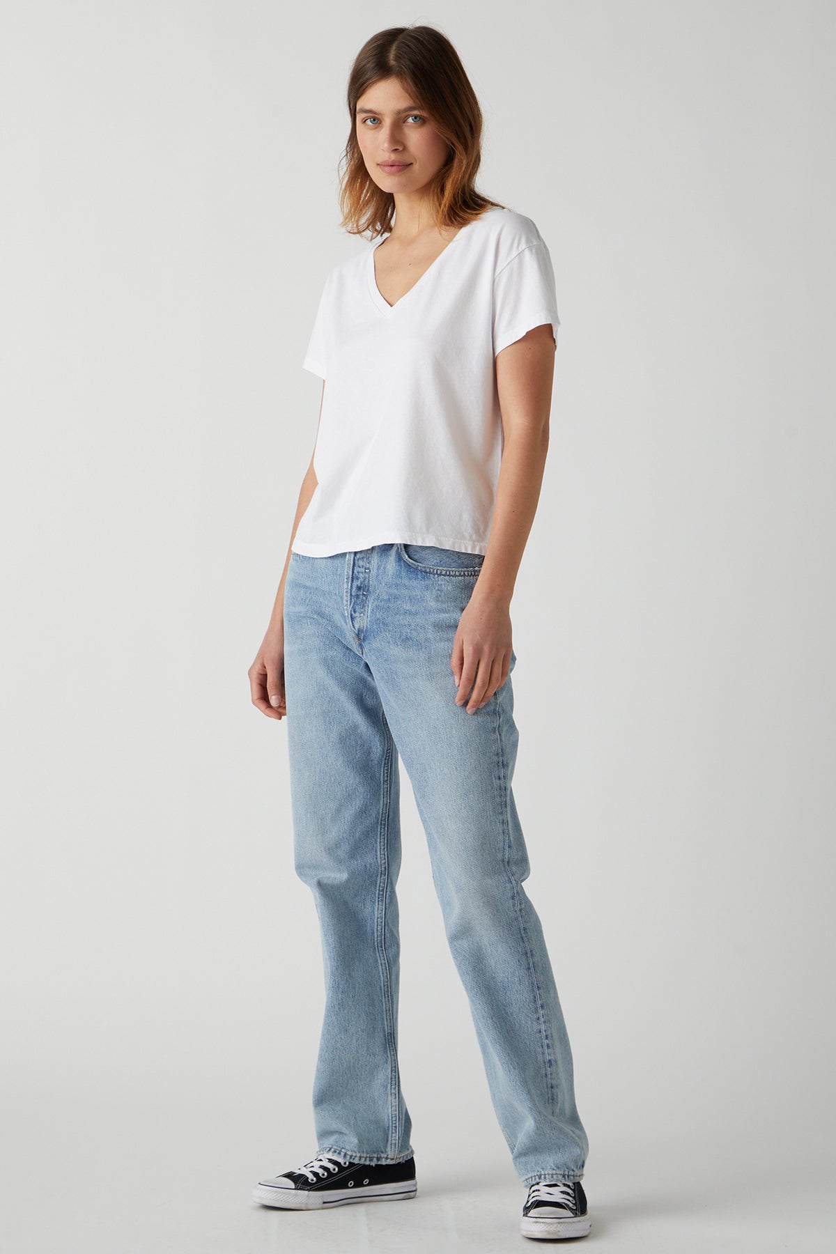 A woman wearing a Velvet by Jenny Graham VENICE TEE and jeans.-25484402950337