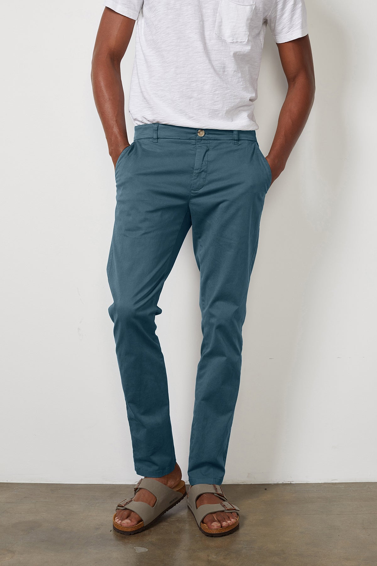   A man wearing Velvet by Graham & Spencer's BROGAN COTTON TWILL PANT and a white t-shirt. 