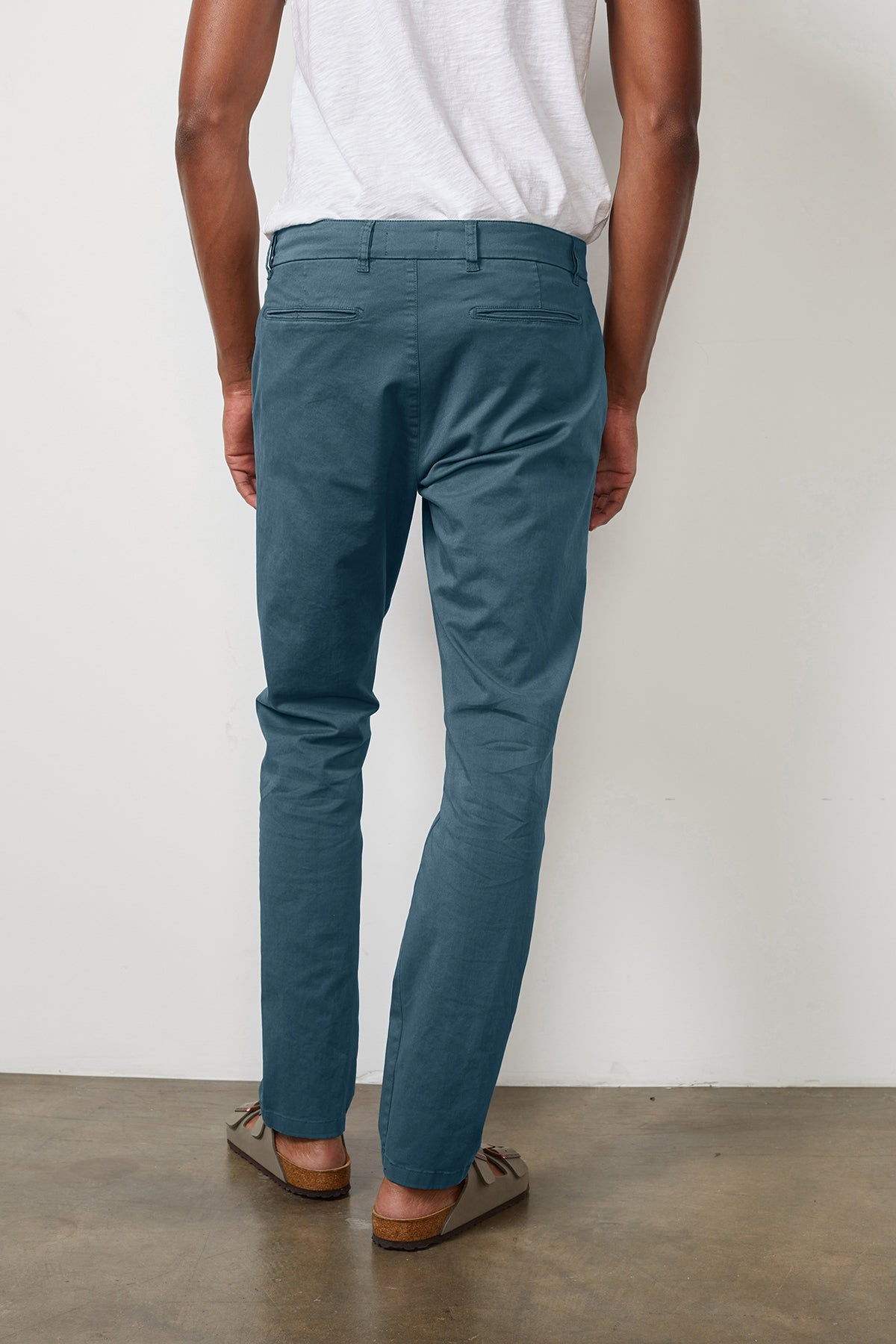   The back view of a man wearing Velvet by Graham & Spencer's BROGAN COTTON TWILL PANT. 