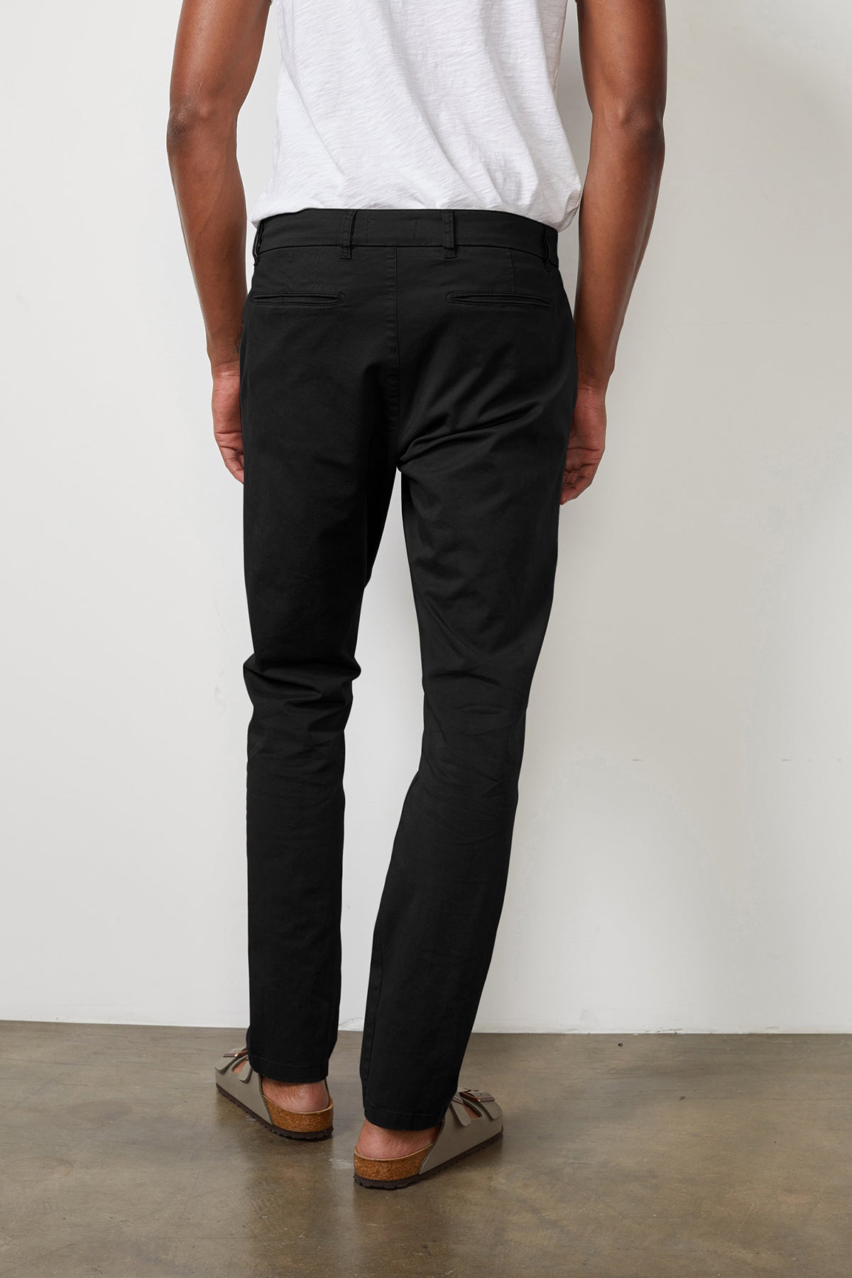   The back view of a man wearing Velvet by Graham & Spencer's BROGAN COTTON TWILL PANT. 