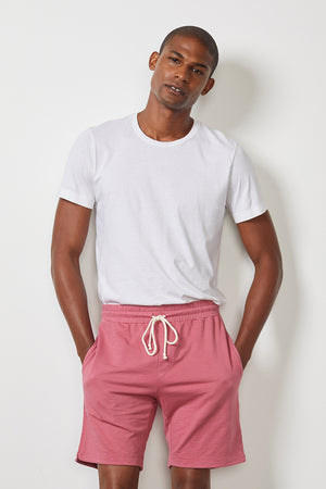 A man wearing the Velvet by Graham & Spencer CYRUS MICRO TERRY SHORT, made from the softest cotton wovens with an elastic waist.