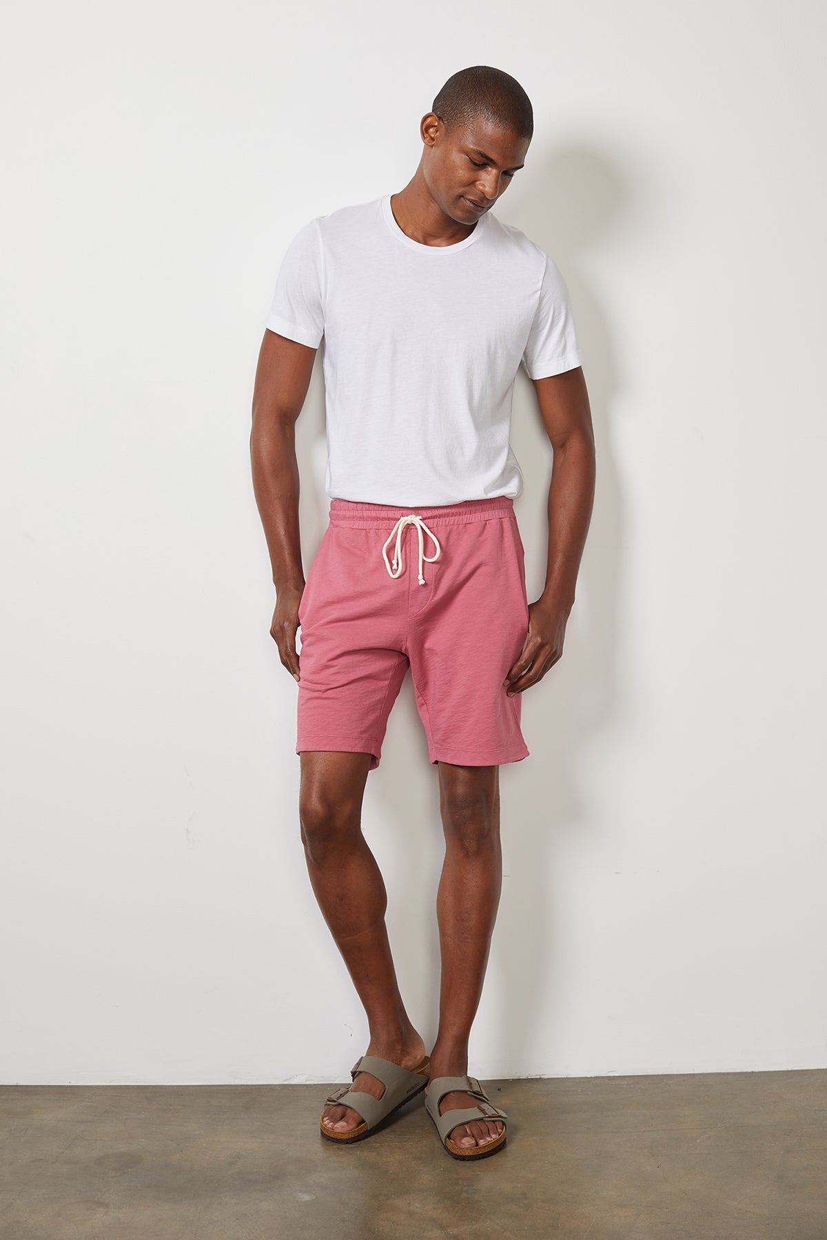 A man wearing Velvet by Graham & Spencer's CYRUS MICRO TERRY SHORT made from the softest cotton wovens and a white t-shirt.-15059521372353