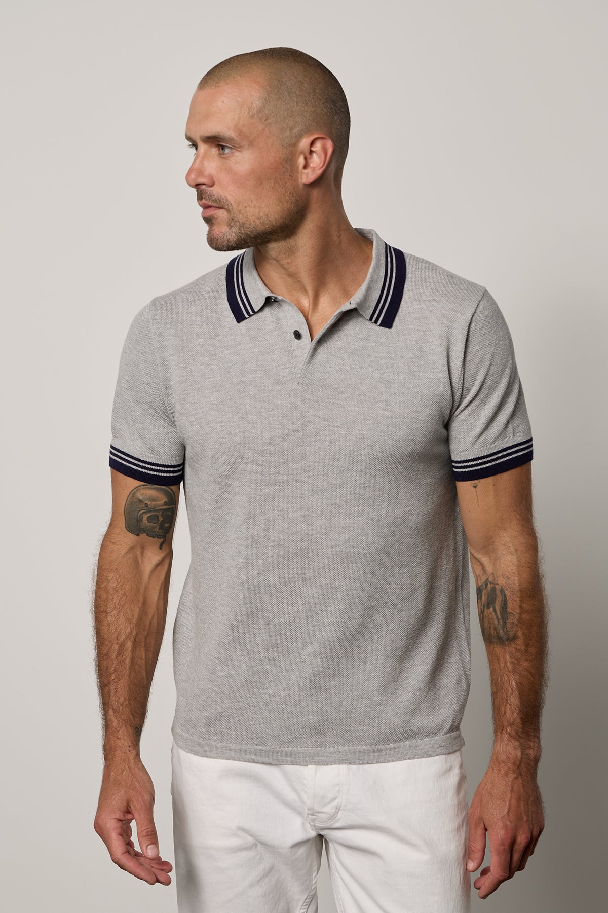   A man wearing a Velvet by Graham & Spencer FINLEY PIQUE POLO with a classic design. 