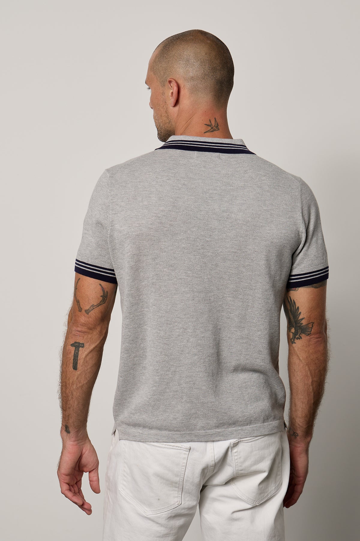 The back view of a man wearing a Velvet by Graham & Spencer FINLEY PIQUE POLO.-26184040284353