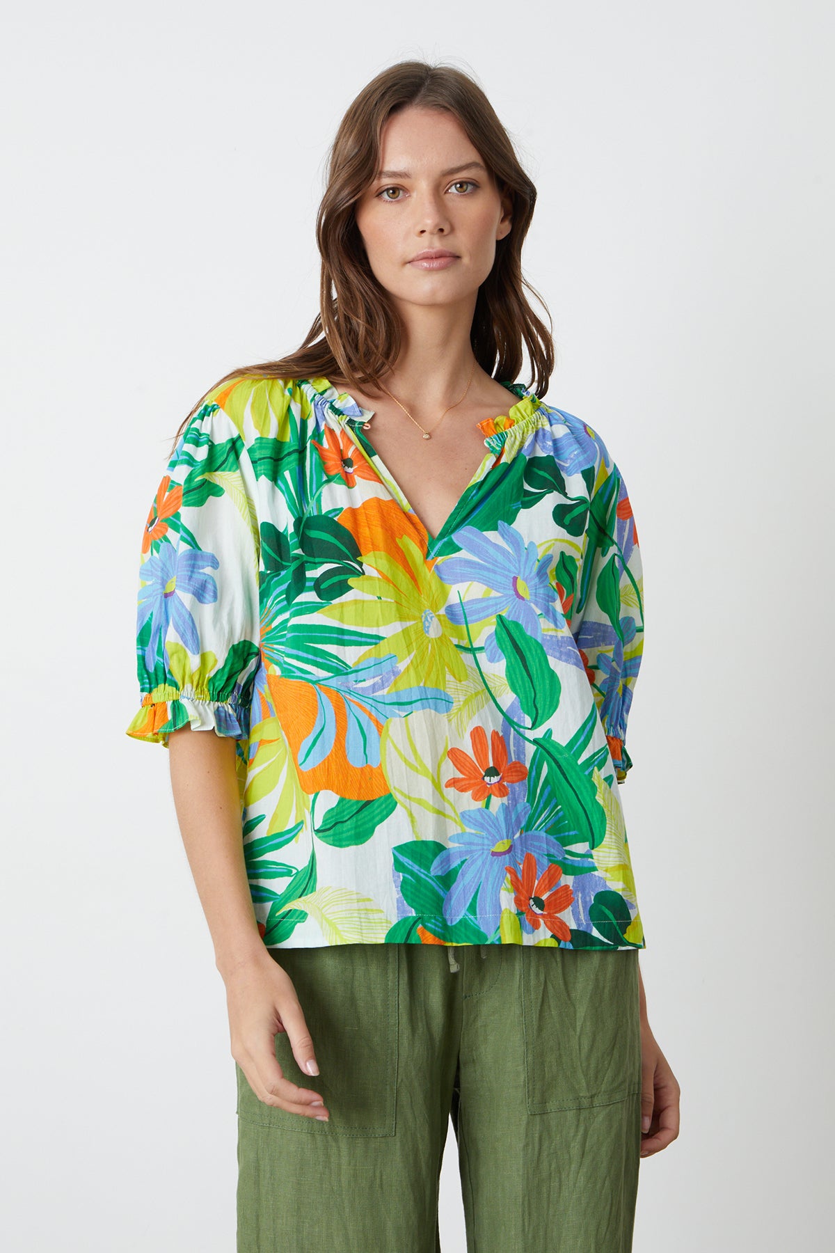 Carrie Boho Top in bold floral mahalo print with blues, greens, orange and yellow green and Dru Pant in basil front with necklace-26255708782785