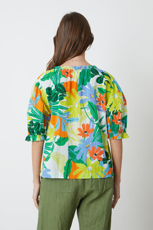 Carrie Boho Top in bold floral mahalo print with blues, greens, orange and yellow green and Dru Pant in basil back