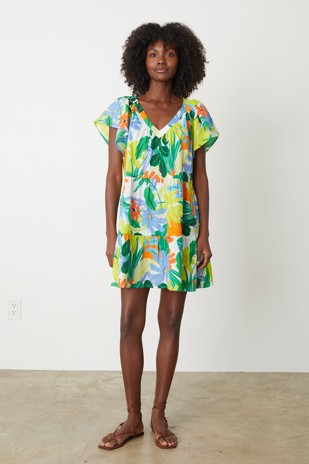   Maeve Tiered Dress in bold floral mahalo print with blues, greens, orange and yellow green full length front 