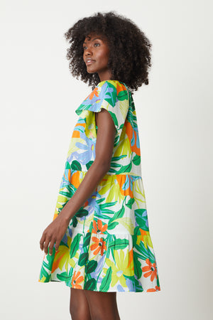 Maeve Tiered Dress in bold floral mahalo print with blues, greens, orange and yellow green side