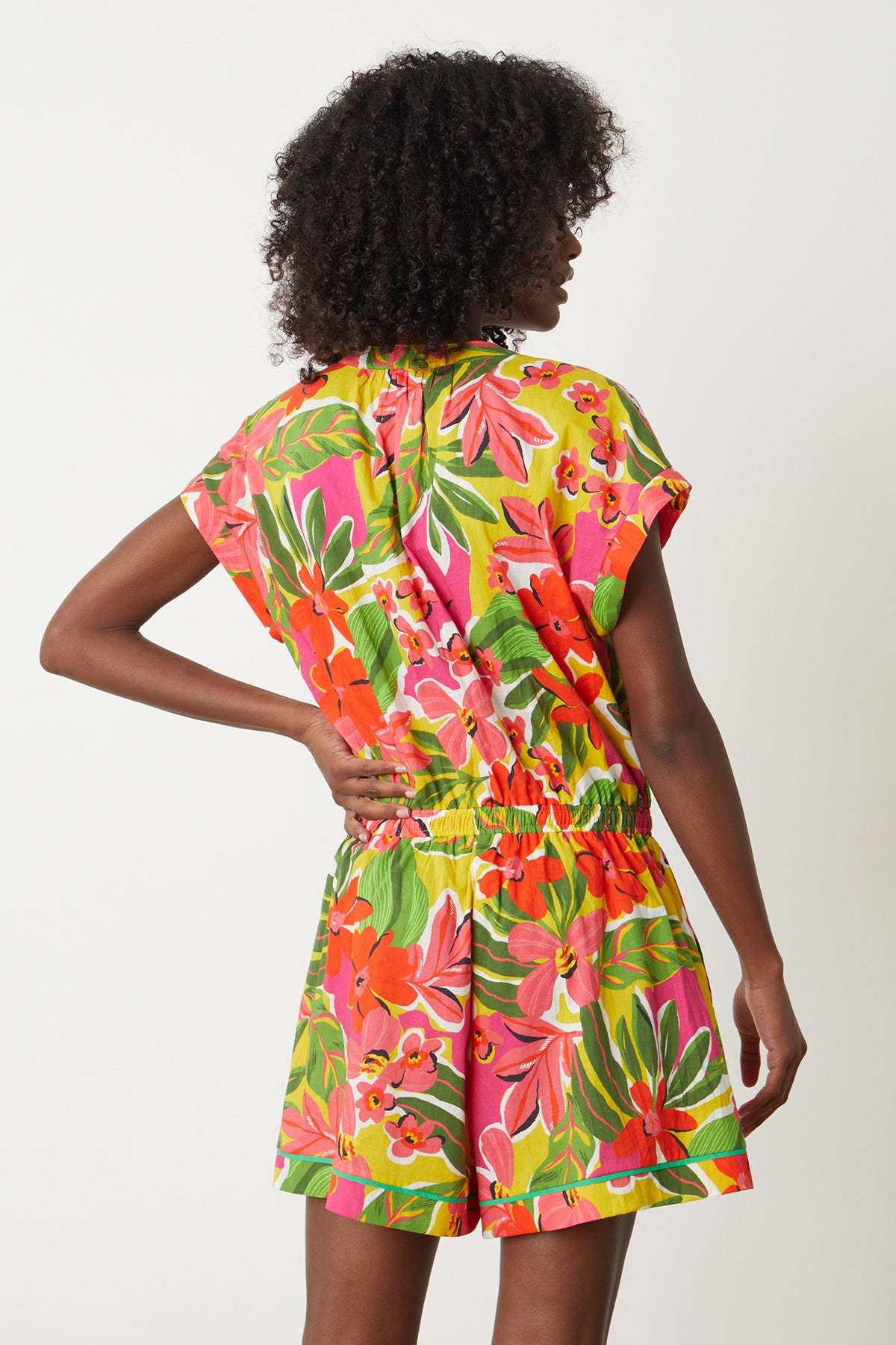  Pam Romper in bold floral aloha print with reds, hot pinks and greens back 