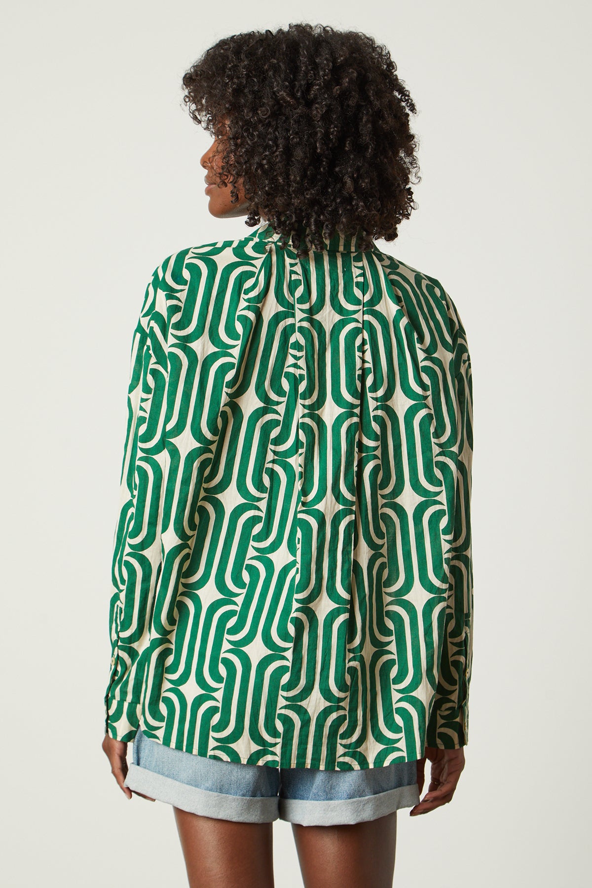 the back view of a woman wearing a Velvet by Graham & Spencer ANNALISE PRINTED TOP shirt.-26142518476993