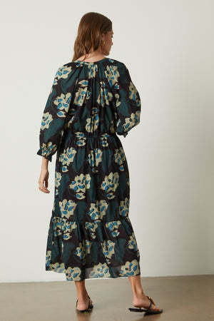 the back view of a woman wearing a Velvet by Graham & Spencer DENISE PRINTED COTTON LACE DRESS.