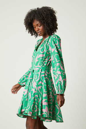 Kiki dress in green with pink print side