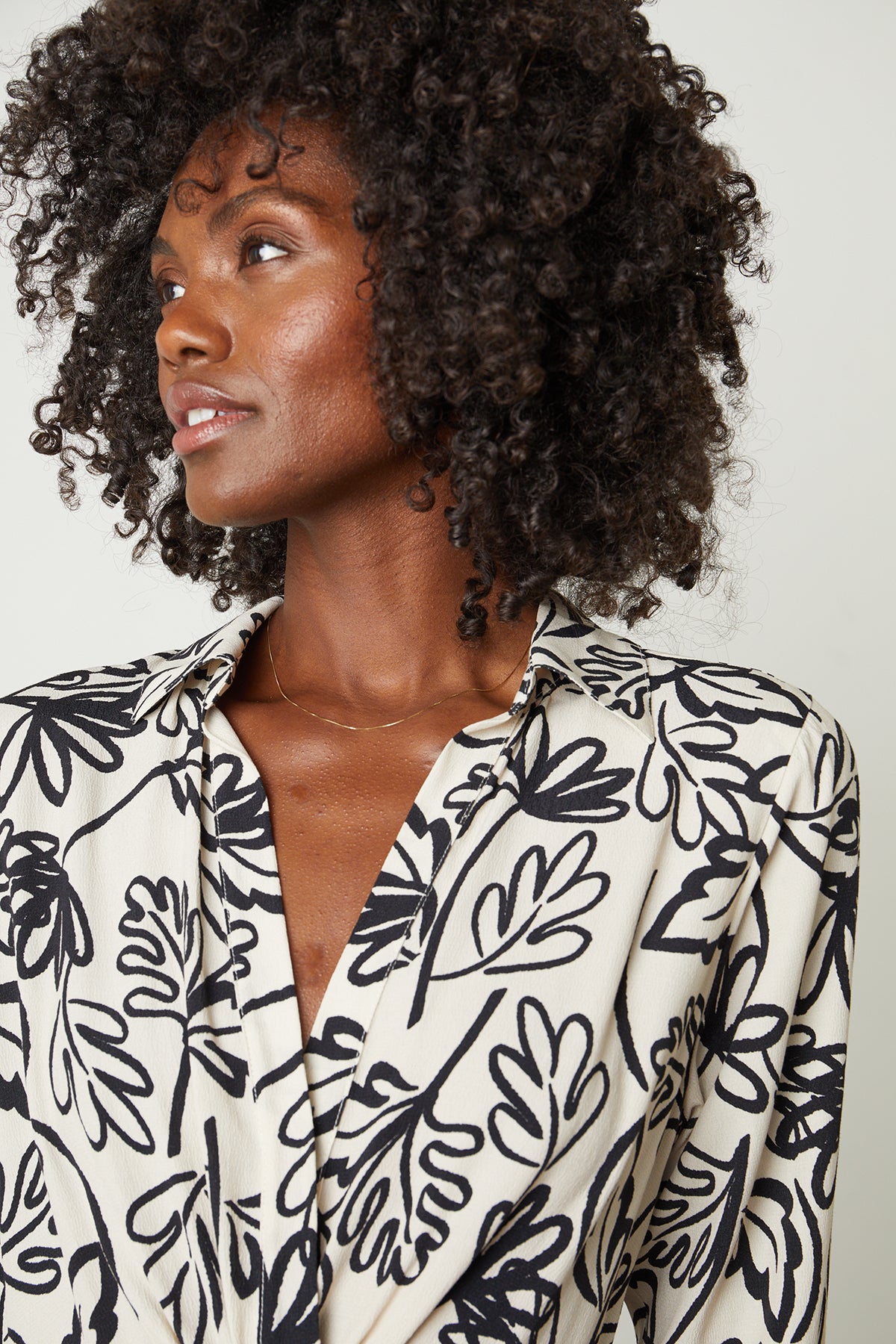 A woman wearing a Velvet by Graham & Spencer Stephie Printed Crepe Dress.-25745217126593