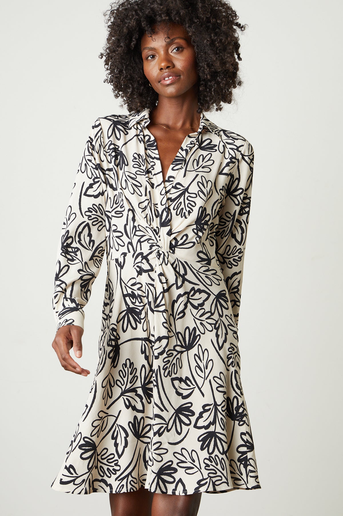   a woman wearing the Velvet by Graham & Spencer STEPHIE PRINTED CREPE DRESS. 