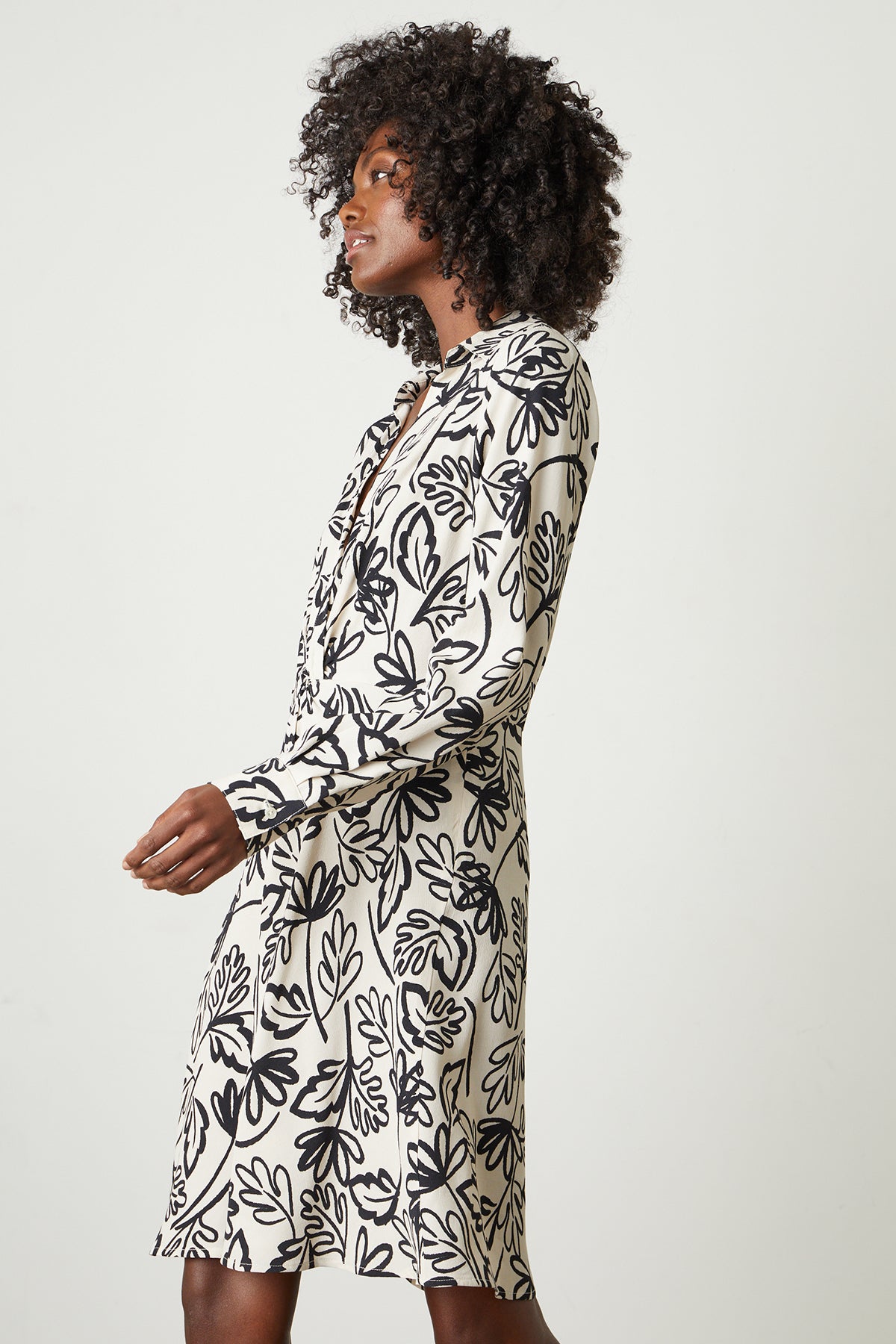 A woman wearing a Velvet by Graham & Spencer STEPHIE PRINTED CREPE DRESS.-25745217028289