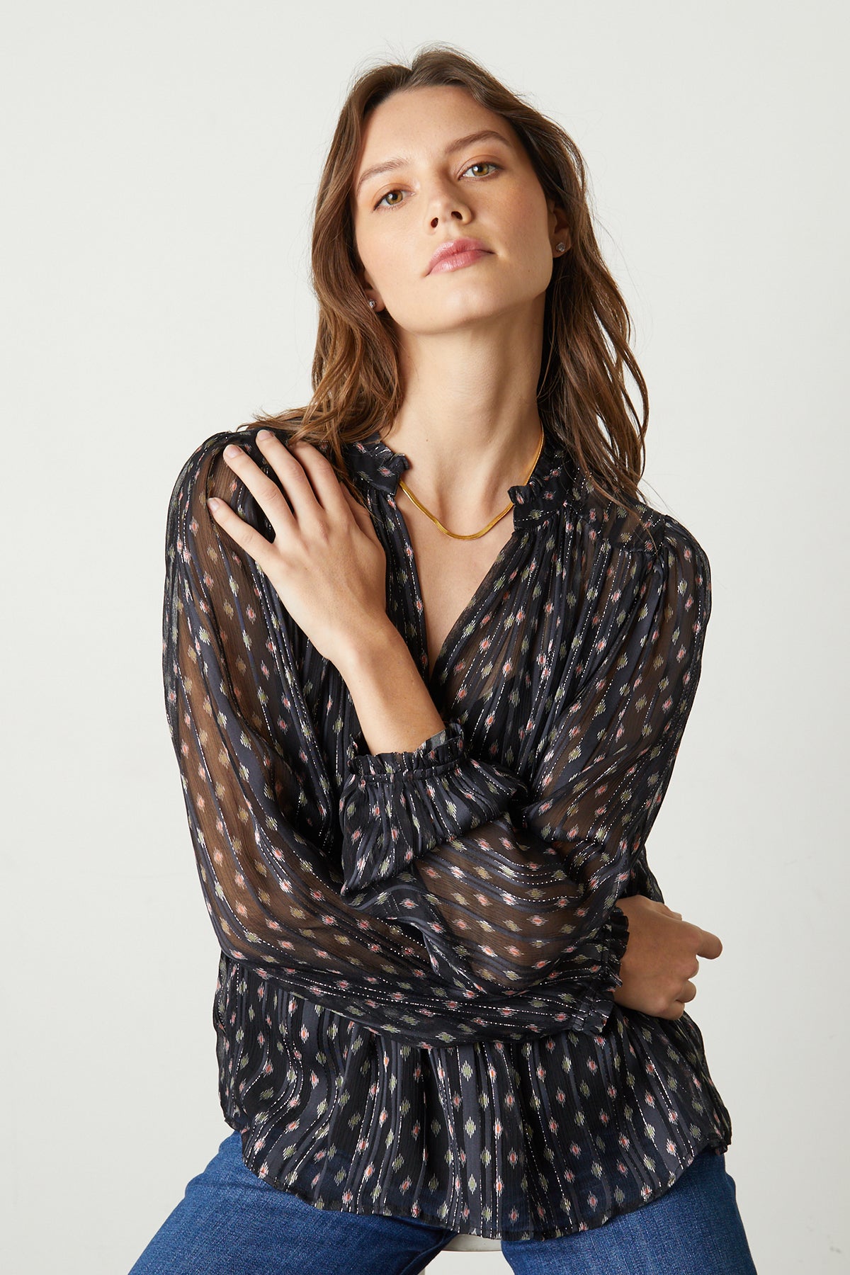   Carla Printed Lurex Stripe top in Starlit pattern front model's arms folded to show sleeve details 