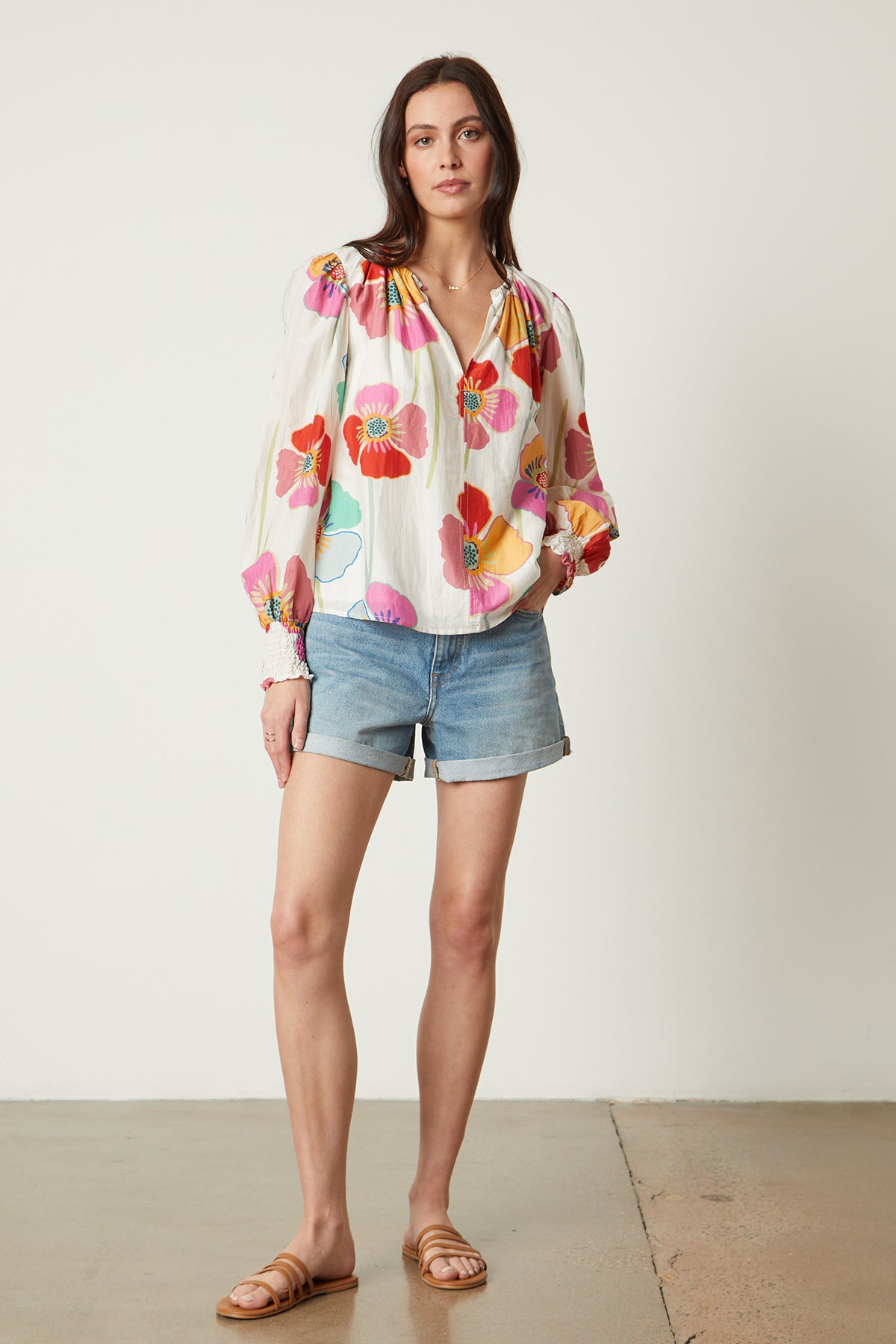   Avery Top in bold floral print with cream background and blue denim shorts full length front 