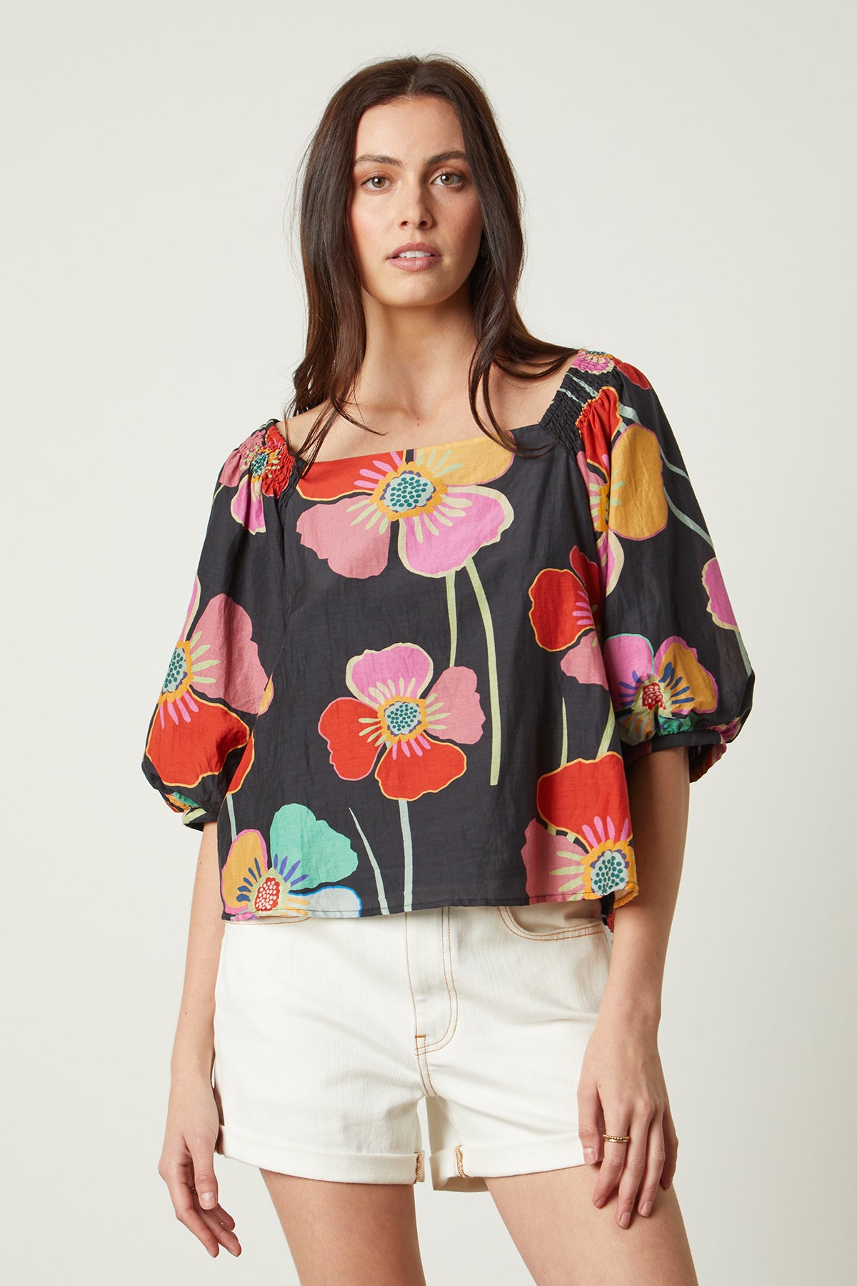   Jasmine Top in bold floral with black background and white denim shorts front 