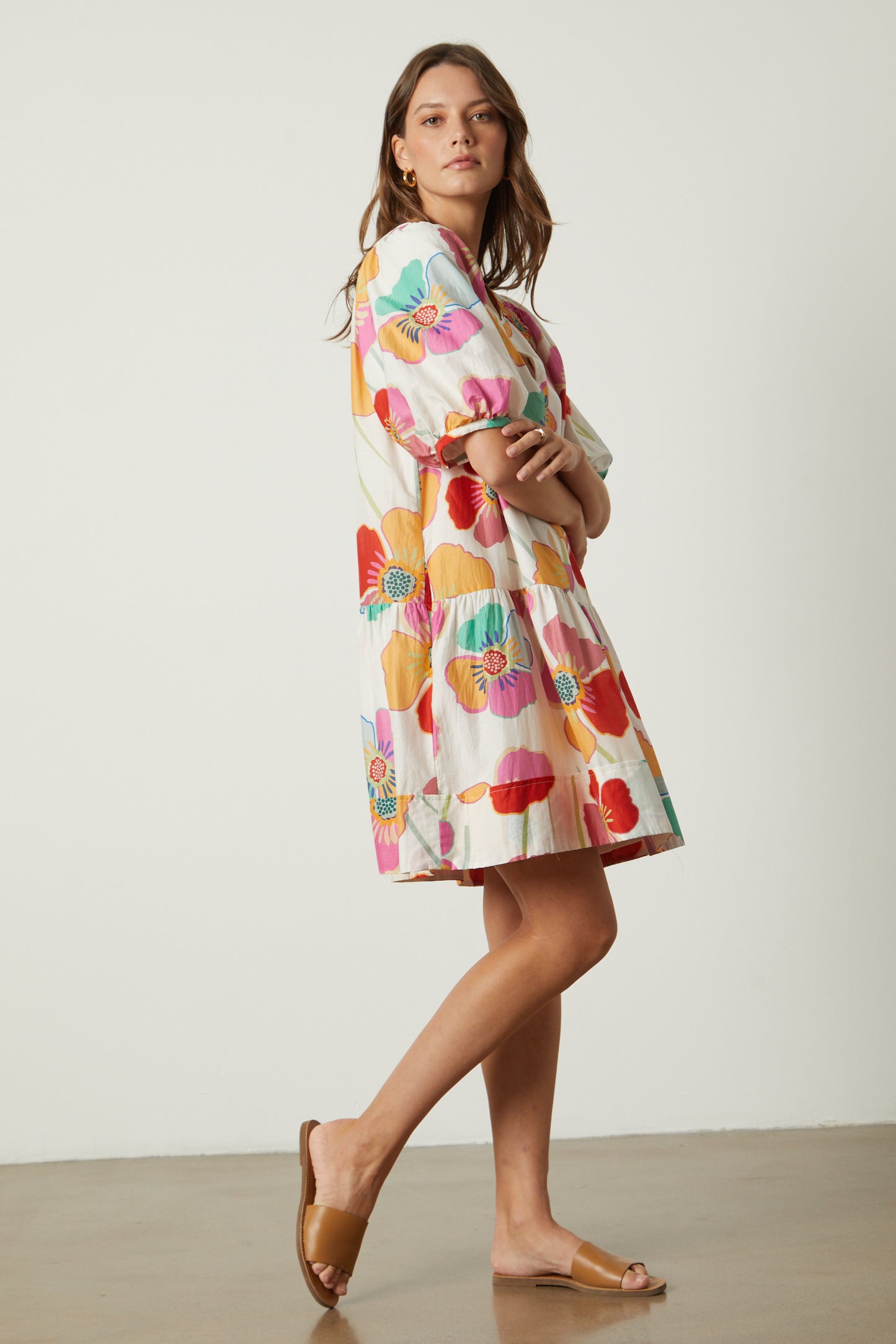 The model is wearing the Velvet by Graham & Spencer RACHEL PRINTED DRESS and sandals.-26286477344961