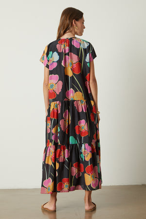 Savannah Maxi Dress in bold floral print on black background full length back untied
