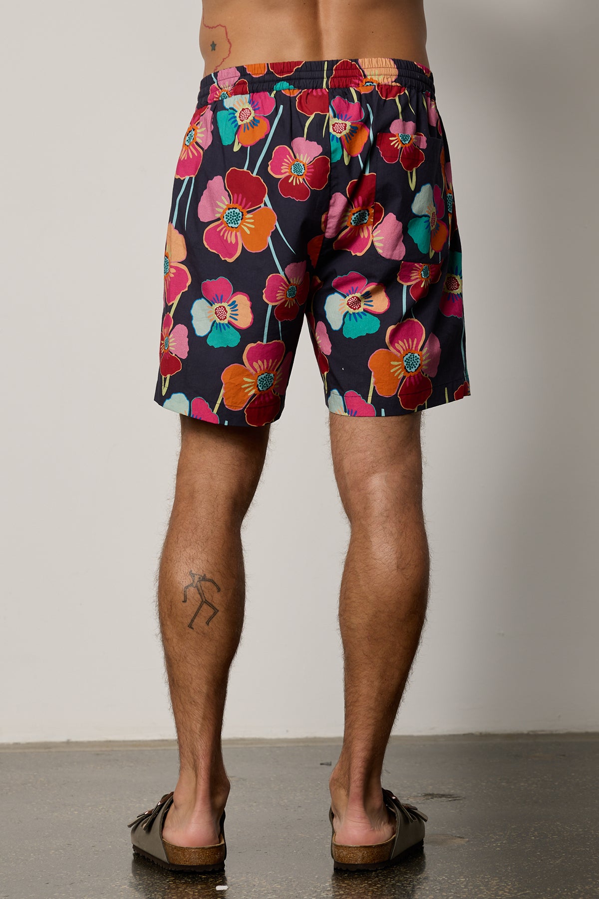   Colt Short back in bahama print with bold, multi colored floral pattern with dark background 