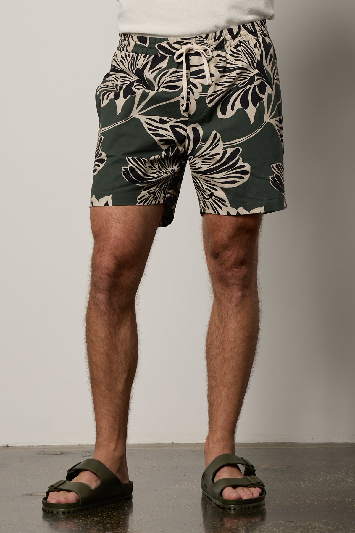   Colt Short front in catalina print with bold, black and cream pattern on dark green background  