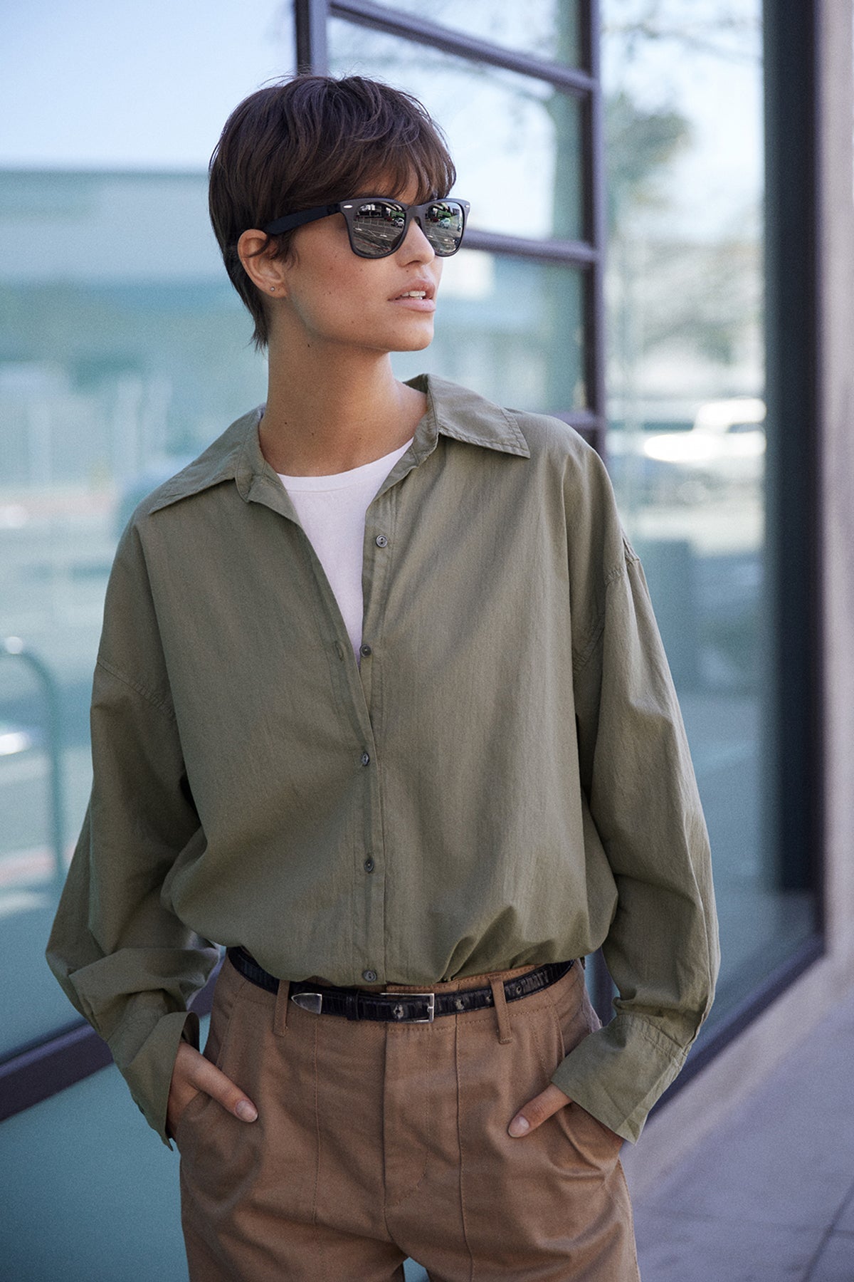 Redondo Shirt in thicket tucked into Ventura Pant front, model wearing sunglasses and black thin belt.-25870844199105