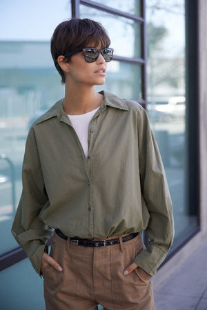 Redondo Shirt in thicket tucked into Ventura Pant front, model wearing sunglasses and black thin belt.