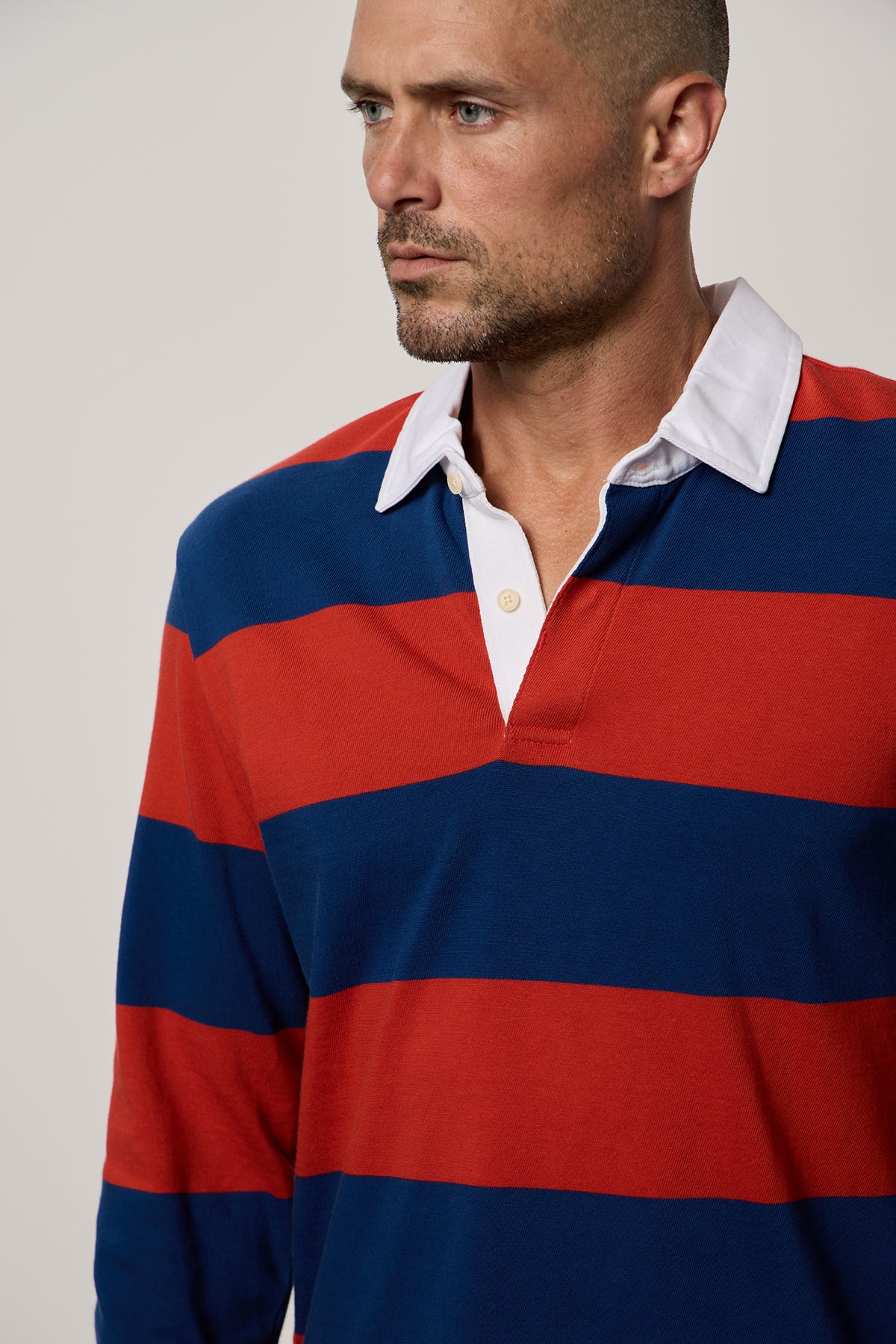 Pierre Rugby Stripe long sleeve polol with broad blue and red stripes and white collar front close up-25994790568129