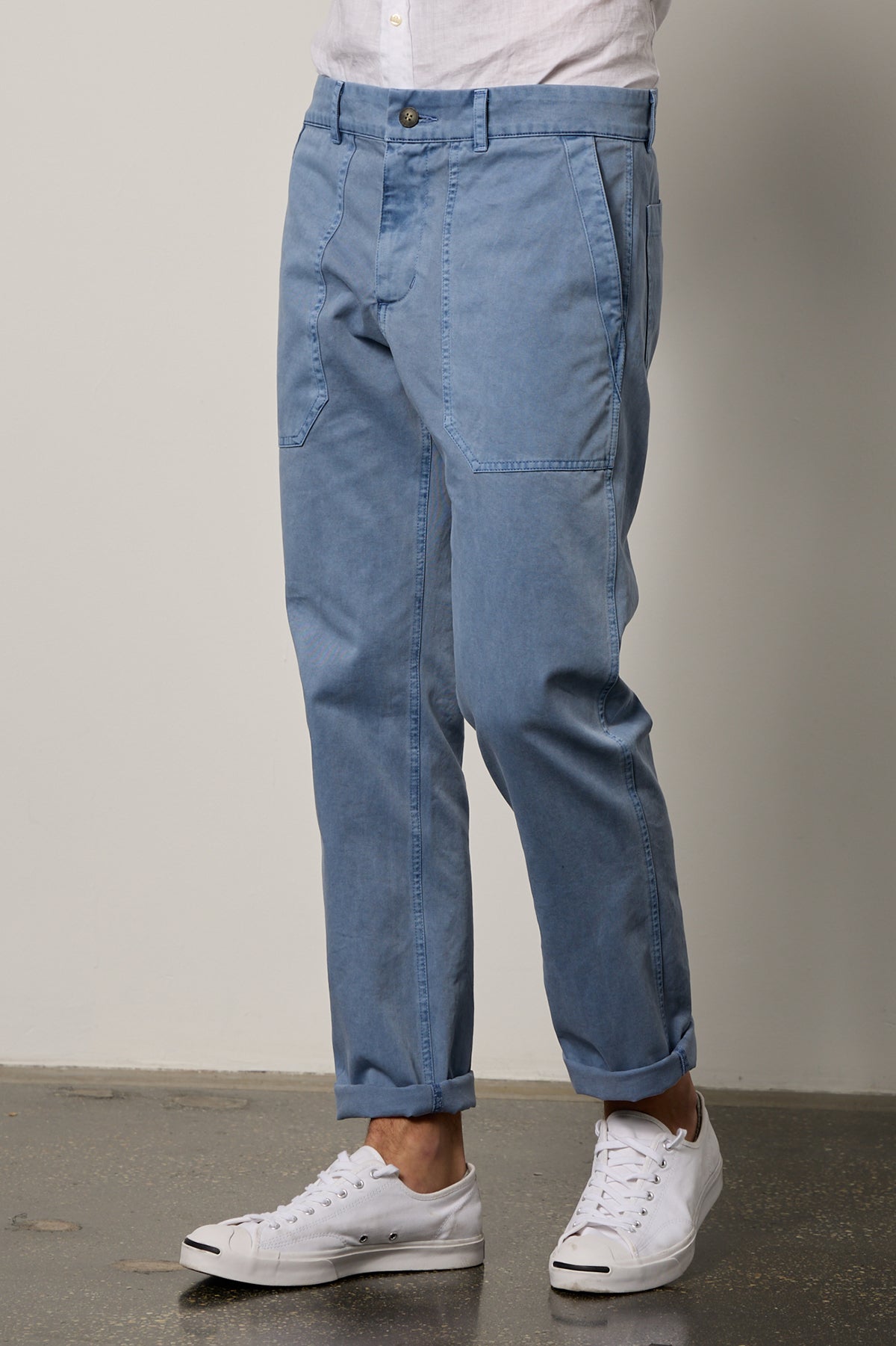  a man wearing blue Velvet by Graham & Spencer RALPH SANDED TWILL PANT and white sneakers. 