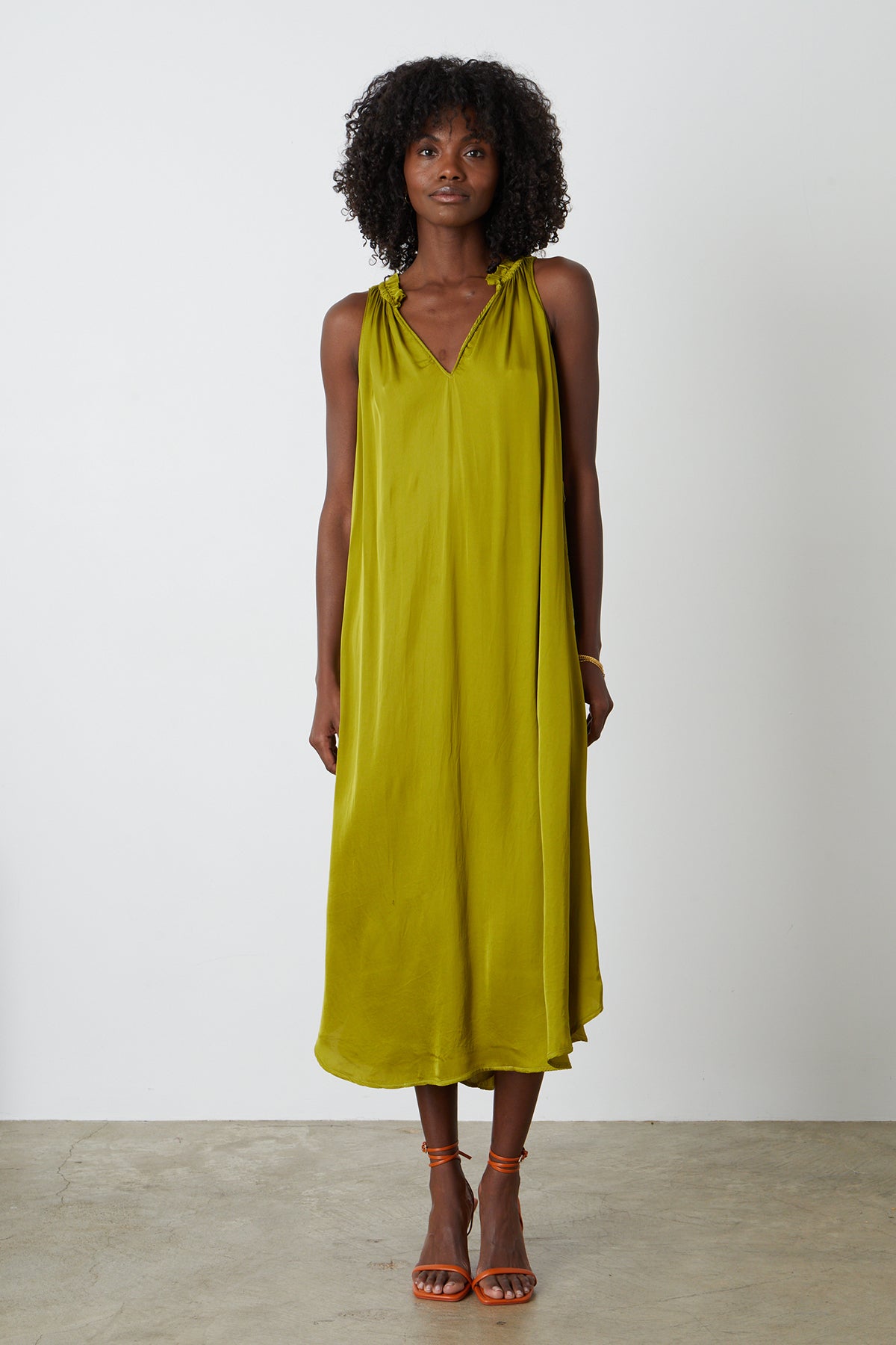 Tala dress in meadow green full length front with orange sandals-25884793700545