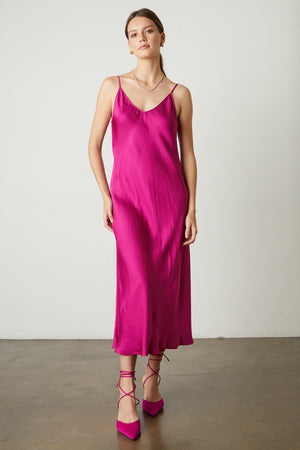 Poppy Satin Slip Dress in bright raspberry pink with matching heels front