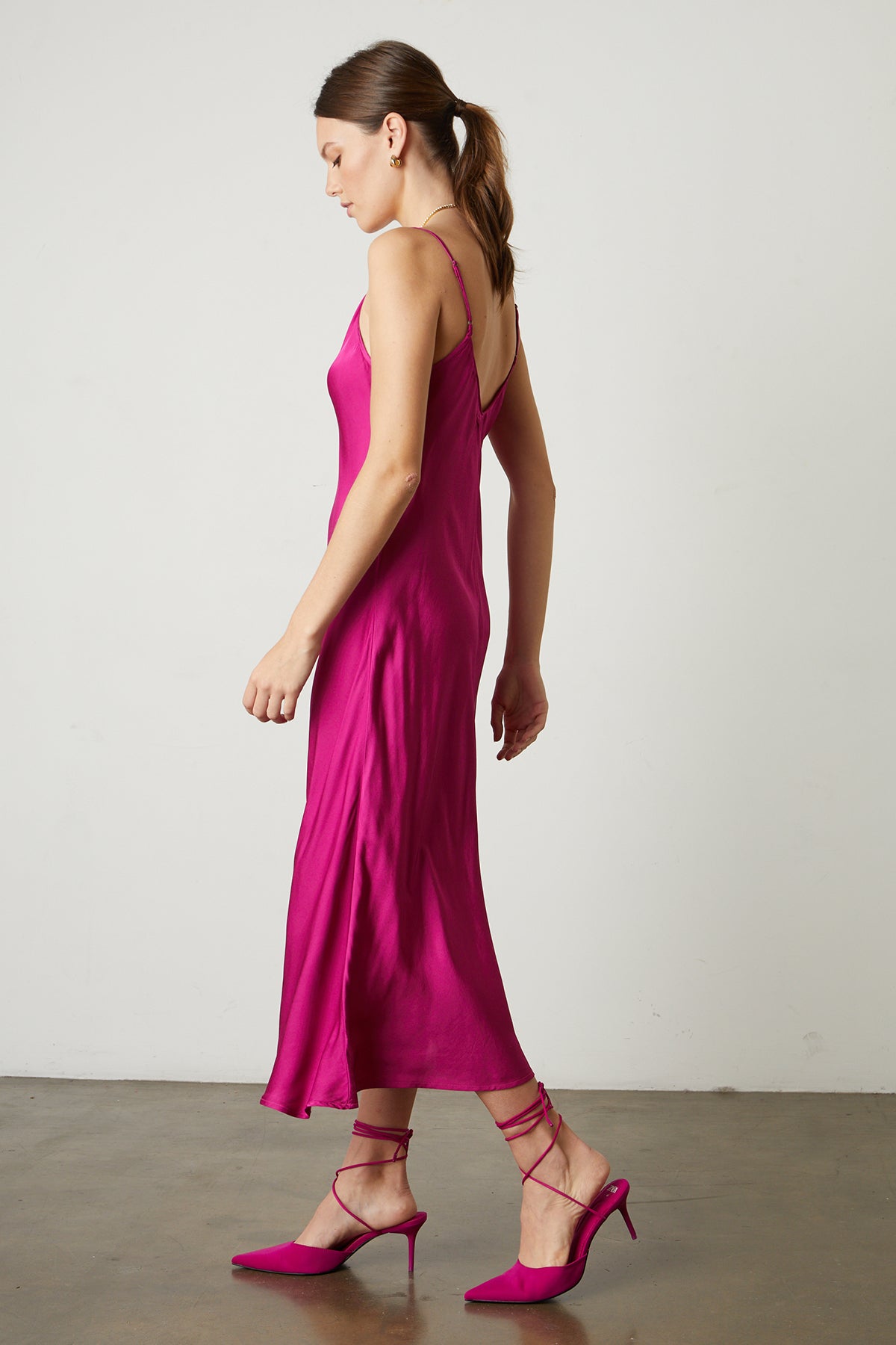   Poppy Satin Slip Dress in bright raspberry pink with matching heels side 
