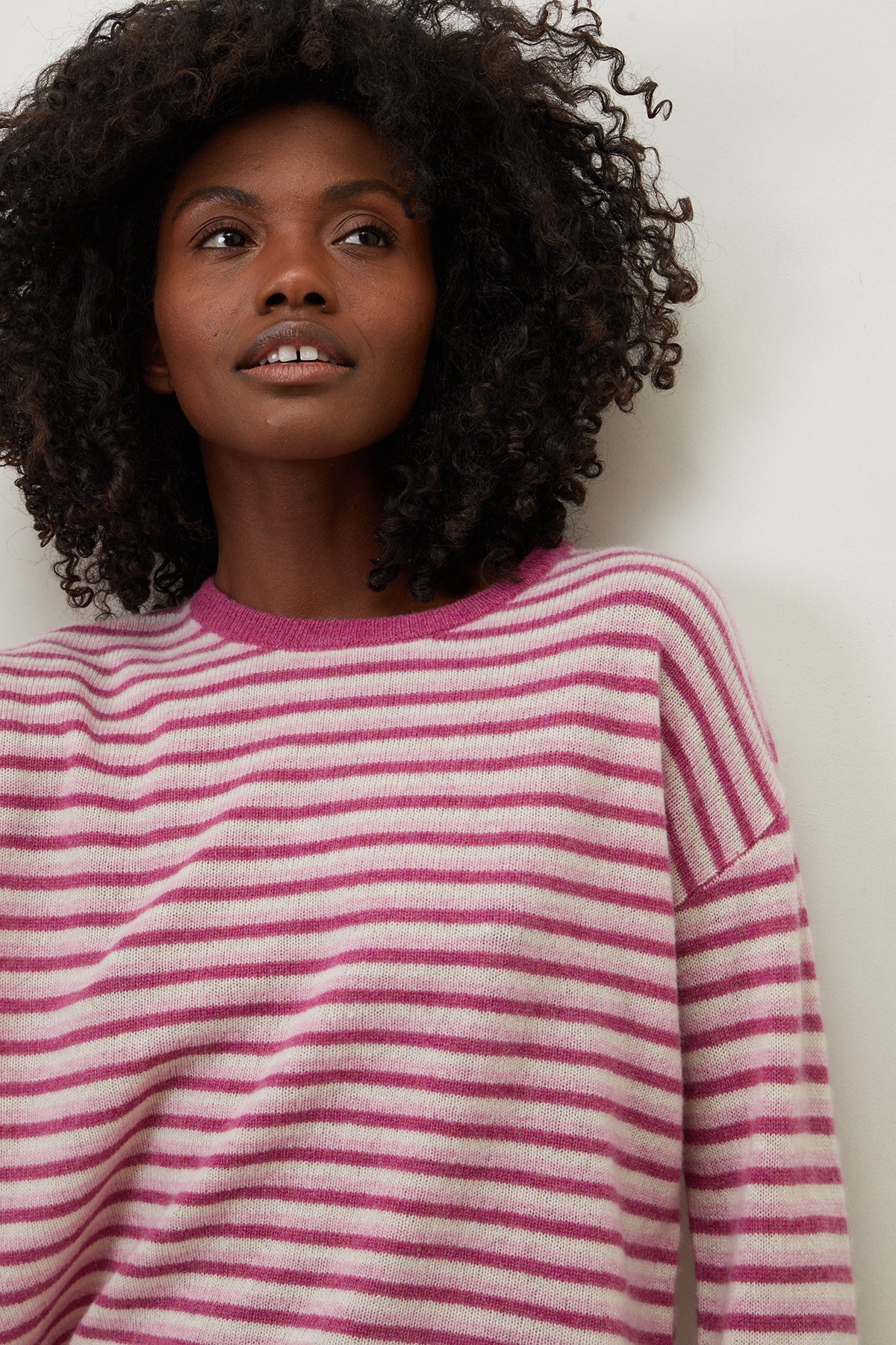 A woman wearing a Velvet by Graham & Spencer CADIE CASHMERE STRIPED SWEATER.-25870939685057