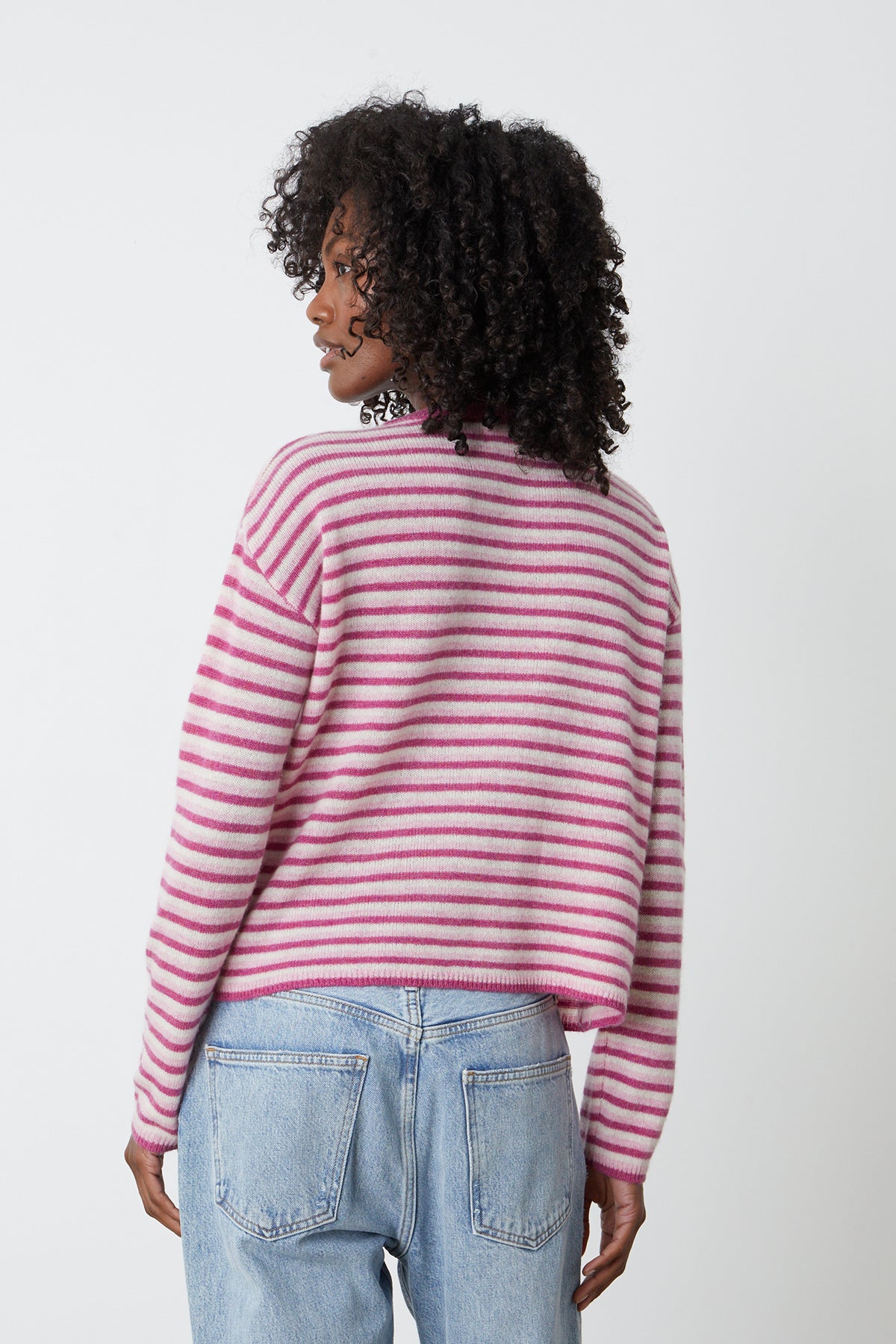 the back view of a woman wearing a Velvet by Graham & Spencer CADIE CASHMERE STRIPED SWEATER.-25870939750593