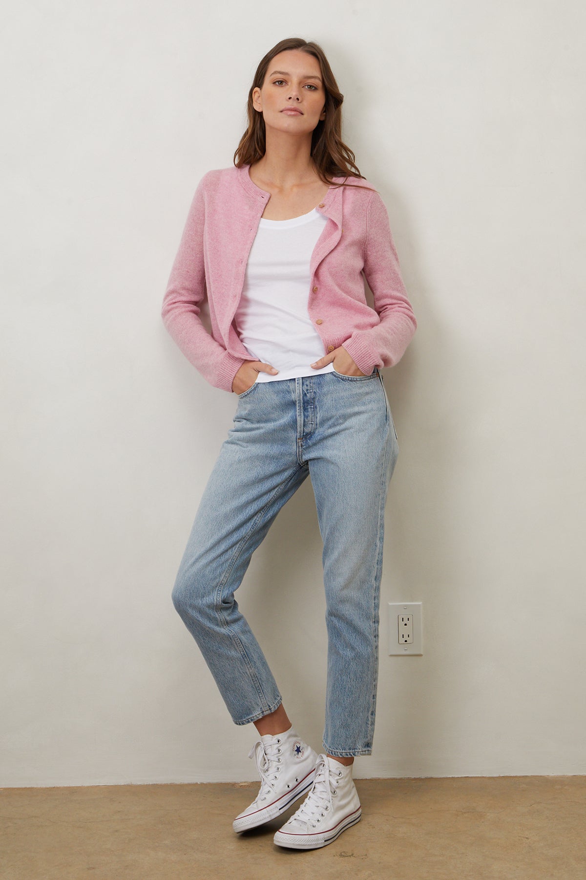   a woman wearing jeans and a NANI CASHMERE CARDIGAN from Velvet by Graham & Spencer. 