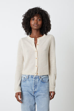 The model is wearing a NANI CASHMERE CARDIGAN by Velvet by Graham & Spencer and jeans.