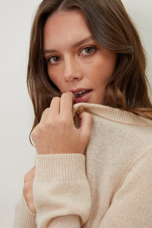 A woman wearing the NANI CASHMERE CARDIGAN by Velvet by Graham & Spencer.