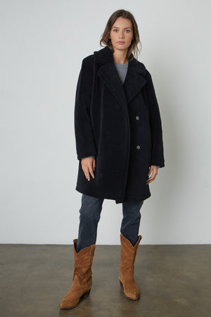 Christine Faux Sherpa Coat in black with black denim and brown boots full length front.