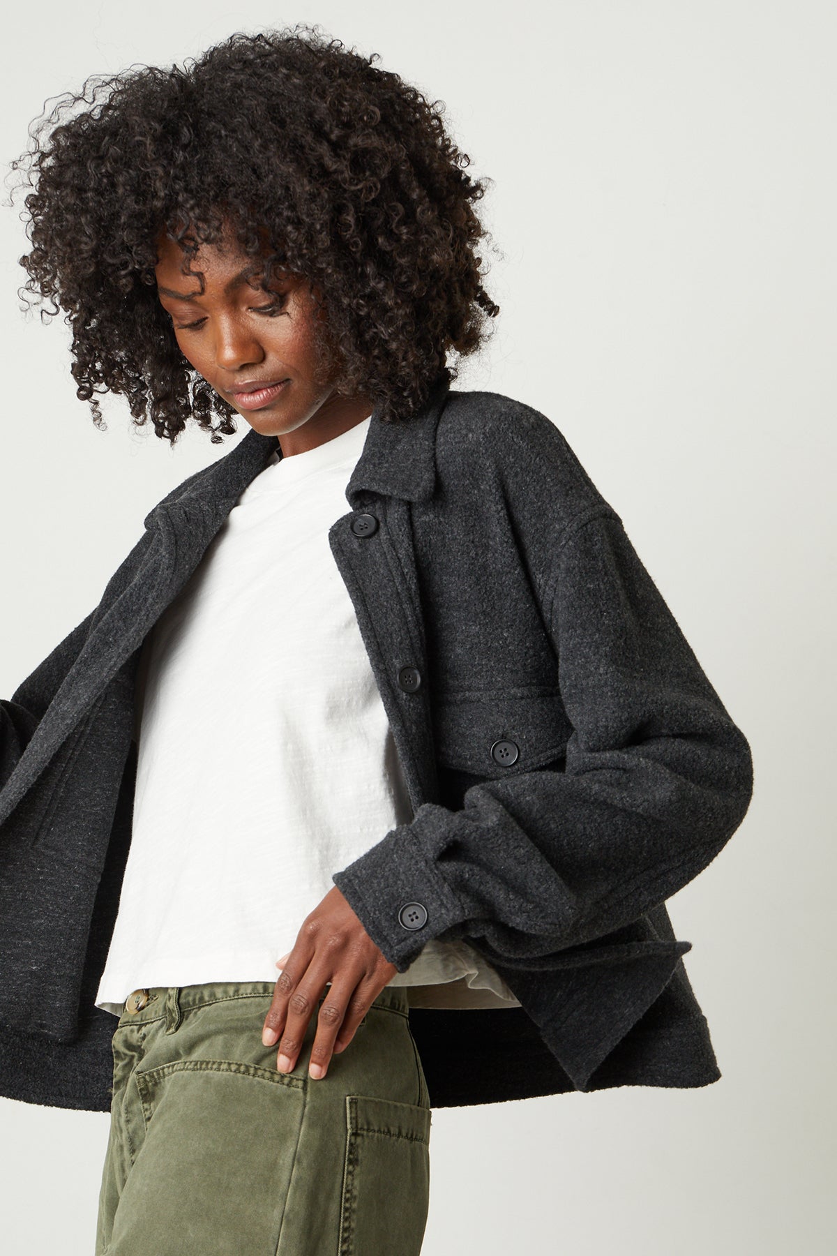 A woman wearing a Velvet by Graham & Spencer KAMERON FLEECE SHACKET and green pants.-26068045299905