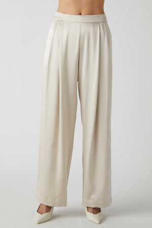 The model is wearing a white Manhattan pant by Velvet by Jenny Graham.