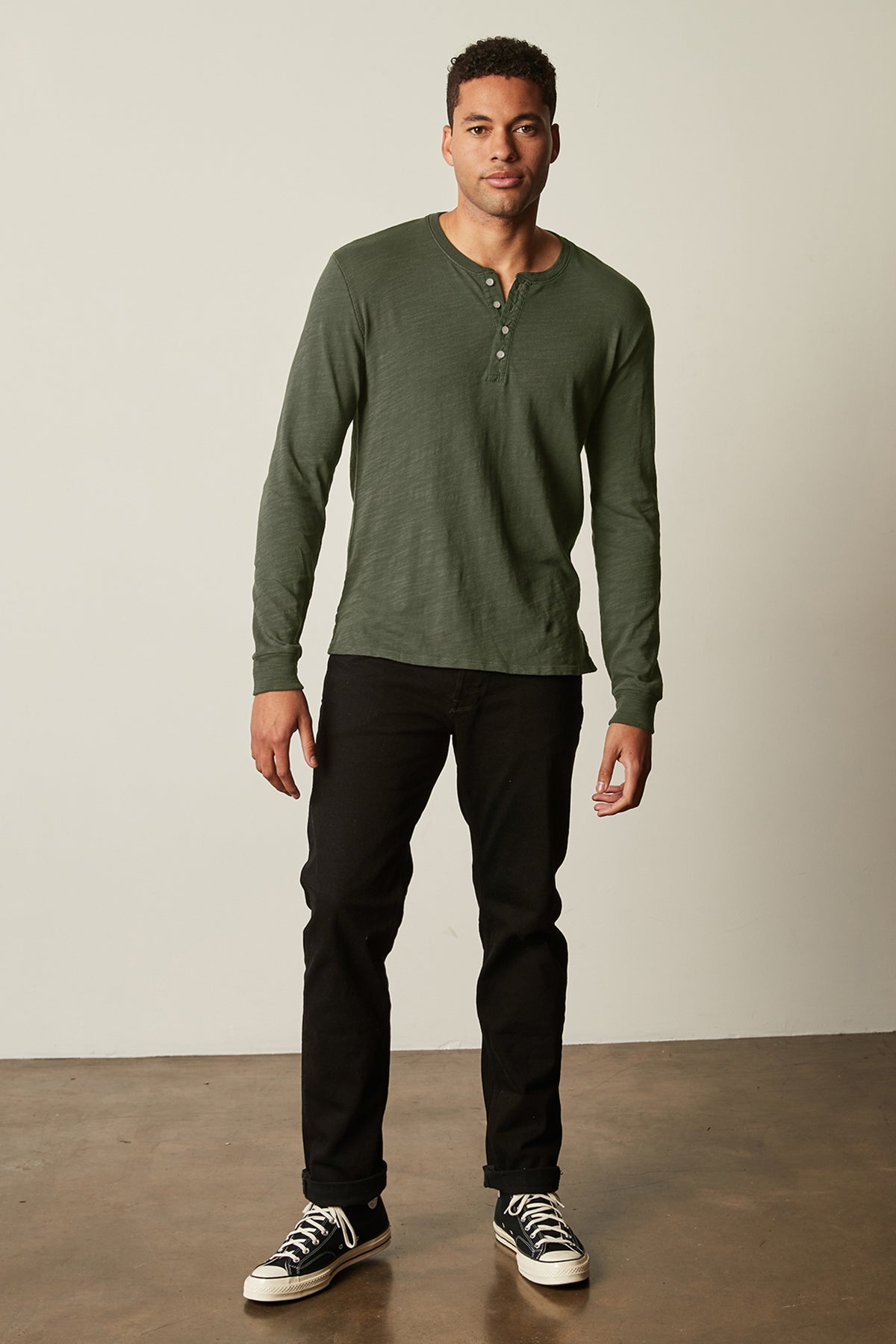Gabe Henley in palm green with black denim full length front with black Converse-25854949851329