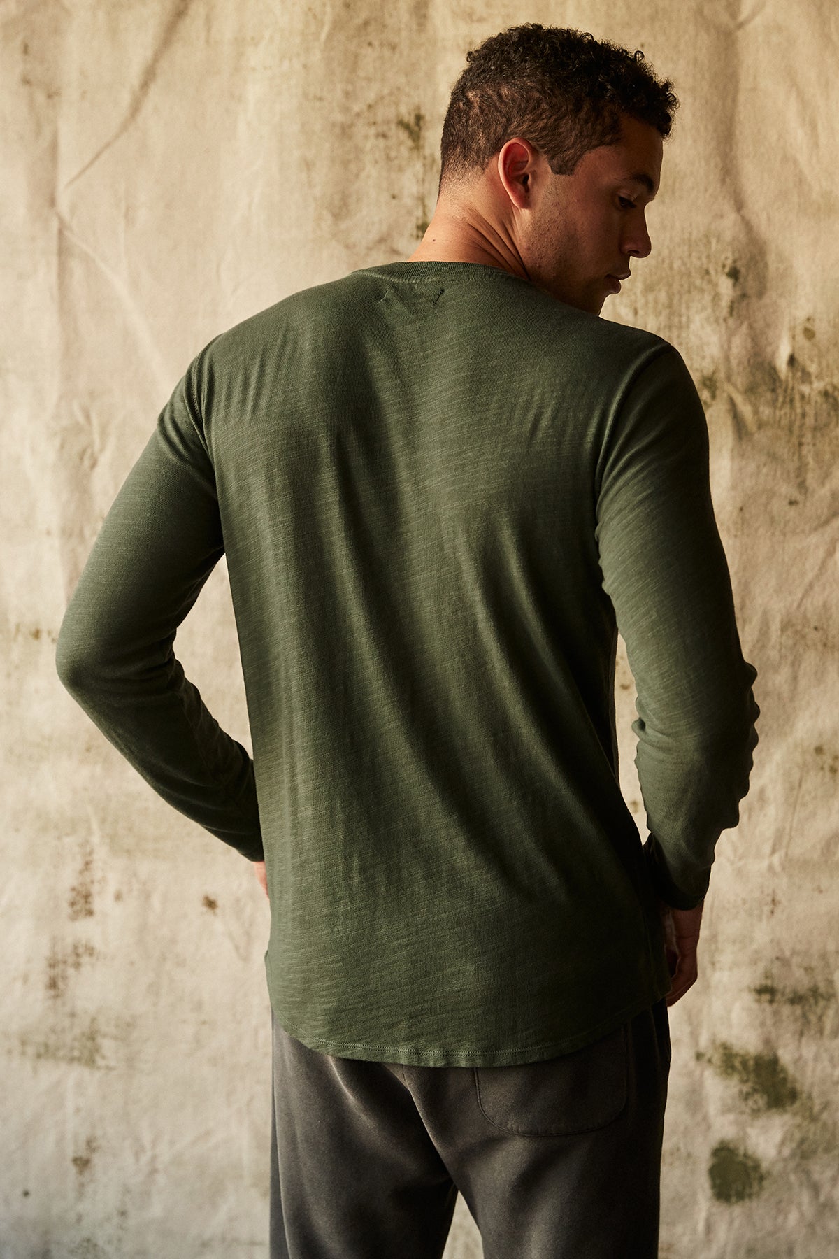 Victor Crew Neck Long Sleeve tee in palm green with dark grey sweatpants back-25854956011713