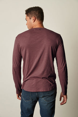 The back view of a man wearing a Velvet by Graham & Spencer KAI CREW NECK TEE, giving off a vintage-feel with its slub knit texture.