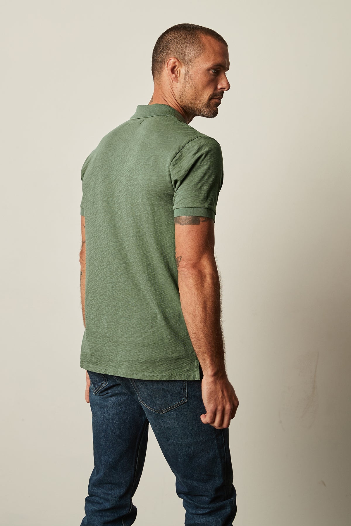   Niko Polo in garden green with dark blue denim back. 