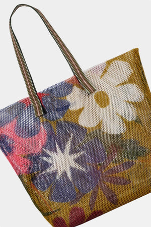 Small mesh tote with olive background, large multi colored flowers and striped fabric handle.
